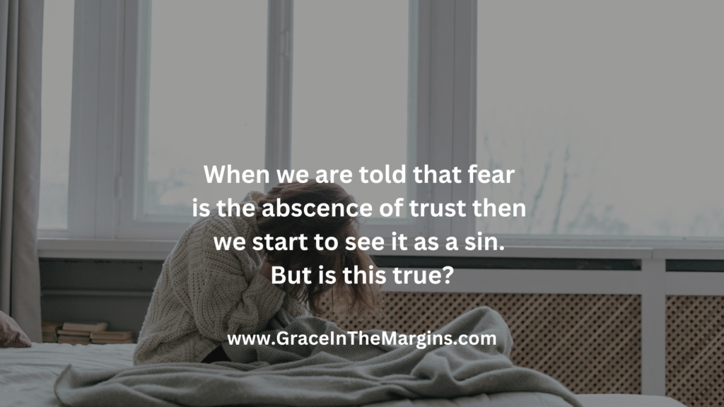 Exhausted woman sitting in bed at 3 AM wrestling with fear and wondering if anxiety and fear is sin