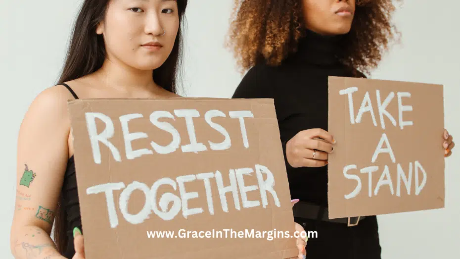 Fear vs anger. Two women holding up cardboard signs that say resist together and take a stand.